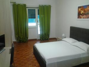Posteľ alebo postele v izbe v ubytovaní Olimpica Relais guest house