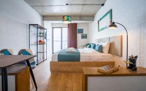 a bedroom with a bed and a table in it at New Gudauri Ski4Life in Gudauri +57 photos