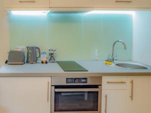 a kitchen with a sink and a counter top at Owl - Uk43447 in Hayle