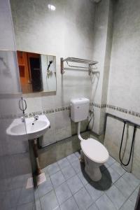 a bathroom with a toilet and a sink at 98 Inn BilikXpert at Chow Kit in Kuala Lumpur