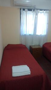 Postel nebo postele na pokoji v ubytování Departamento San Rafael + 17 fotografií