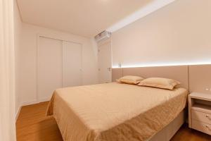 Postel nebo postele na pokoji v ubytování Apto Charmoso e Bem Localizado em Bombas