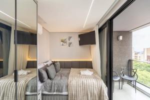 Χώρος καθιστικού στο Varanda panorâmica | Suíte Comfort Batel