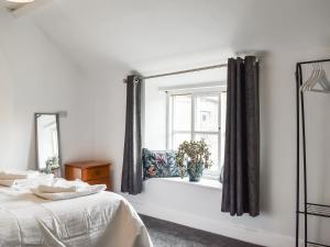 En eller flere senge i et værelse på Rose Croft + 8 billeder