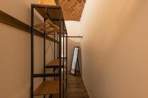 a staircase in a room with wooden floors and a wall at La Casina del Popi in Arezzo