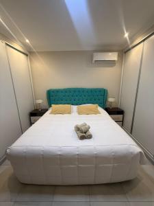 Ένα ή περισσότερα κρεβάτια σε δωμάτιο στο Apart H&L CON BALCON Y PARRILLA