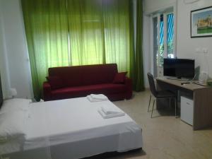 Posteľ alebo postele v izbe v ubytovaní Olimpica Relais guest house