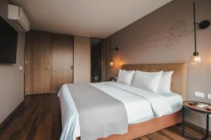 Giường trong phòng chung tại Sites Hotel +54 ảnh