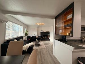 a living room with a couch and a table at Golden Acres in Calming Caldwell in Caldwell