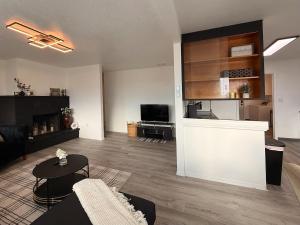 a living room with a couch and a table at Golden Acres in Calming Caldwell in Caldwell +30 photos