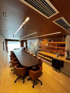 a conference room with a large table and chairs at Gran Mareiro Hotel in Fortaleza +86 photos