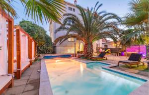 a swimming pool in the backyard of a house at Amazing Apartment In Sukosan in Sukošan