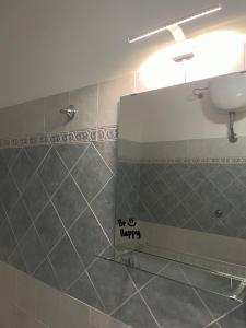 a bathroom with a sink and a mirror on the wall at Fun House in Trabia +13 photos