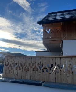 a fence with a bunch of scissors on it at Ferienhaus Korda in Ramsau am Dachstein