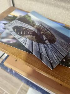 a wooden table with photographs on top of it at Martin Pescador in Puerto Montt