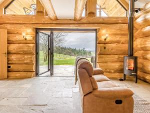 a living room with a couch and a fireplace at Hope Hideaway 