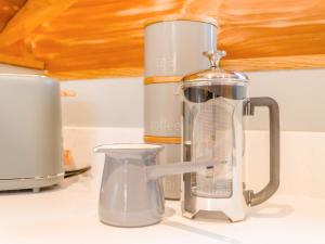 a blender sitting on top of a kitchen counter at Hope Hideaway  +17 photos