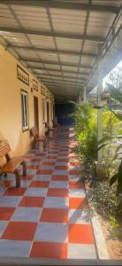 a tiled floor with benches on a building at Chbar mom apartments 