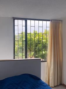 Ένα ή περισσότερα κρεβάτια σε δωμάτιο στο Apartamento 202 frente a UPTC