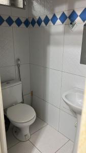 a bathroom with a toilet and a sink at Eds pousada in Juazeiro do Norte +17 photos