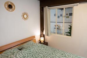 Postel nebo postele na pokoji v ubytování Charmant appartement alsacien au cœur de Rosheim