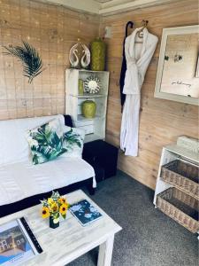 a room with a bed and a table with flowers at Evermore Stay in Richmond