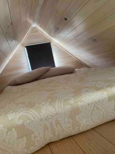 a bedroom with a bed with a window in it at Evermore Stay in Richmond +16 photos