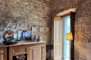 TV a/nebo společenská místnost v ubytování Chiesa Storica In Toscana Con Vista Panoramica