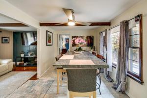 a dining room with a large table and chairs at Easy Cleveland Access! Quiet Suburb Stay with Yard in Oakwood