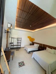 Postel nebo postele na pokoji v ubytování Casa Pepe