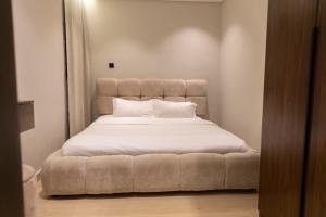 Postel nebo postele na pokoji v ubytování Apartment in Al-Qairawan