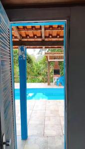 a view of a pool through a door at Pousada Bella Ana in Visconde De Maua