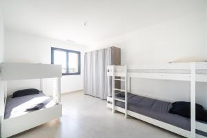 Postel nebo postele na pokoji v ubytování Villa spacieuse ambiance cosy près d'Arles Nîmes Avignon - jusqu'à 12 personnes