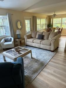 a living room with a couch and a coffee table at Life at the lake in Inverness