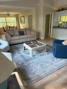 a living room with a couch and a coffee table at Life at the lake in Inverness