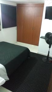 Postel nebo postele na pokoji v ubytování APARTAMENTOS ESTADIO MK REMODELADOS EN LA MEJOR ZONA DE MEDELLIiN + 24 fotografií