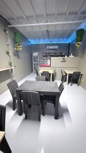 a dining room with a table and chairs at Seaside traveler's Inn by Camiguin Island Home in Catarman