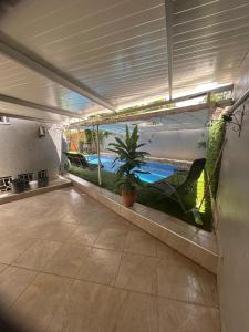 an indoor patio with a view of a swimming pool at Dar el kebira in Meknès
