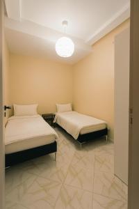 Postel nebo postele na pokoji v ubytování Relax Family 12 - Cozy Entire Apartment in City Center + 13 fotografií