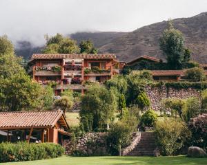 a house on the side of a mountain at Rio Sagrado, A Belmond Hotel, Sacred Valley in Urubamba