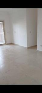 an empty room with white walls and a white floor at Al-Saeed Appartments in Cairo