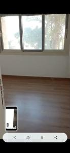 a view of a window in a room with a microwave at Al-Saeed Appartments in Cairo