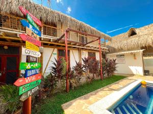 a building with signs next to a swimming pool at Rincon del Mar Palomino in Palomino