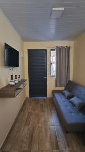 Μια τηλεόραση ή/και κέντρο ψυχαγωγίας στο Casa tranquila no Santinho +9 φωτογραφίες