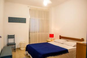 Postel nebo postele na pokoji v ubytování Xango 103 - Ótima Localização 100m da praia + 37 fotografií