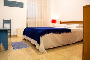 Postel nebo postele na pokoji v ubytování Xango 103 - Ótima Localização 100m da praia