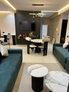 a living room with a couch and a table at Vue Mer Exeptionnelle à Essaouira in Essaouira