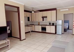 Kuchyň nebo kuchyňský kout v ubytování The City Nest