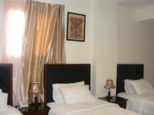Uma cama ou camas num quarto em Best View Pyramids Hotel