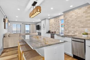 a kitchen and living room with a large counter top at Mama's Little House in Virginia Beach
